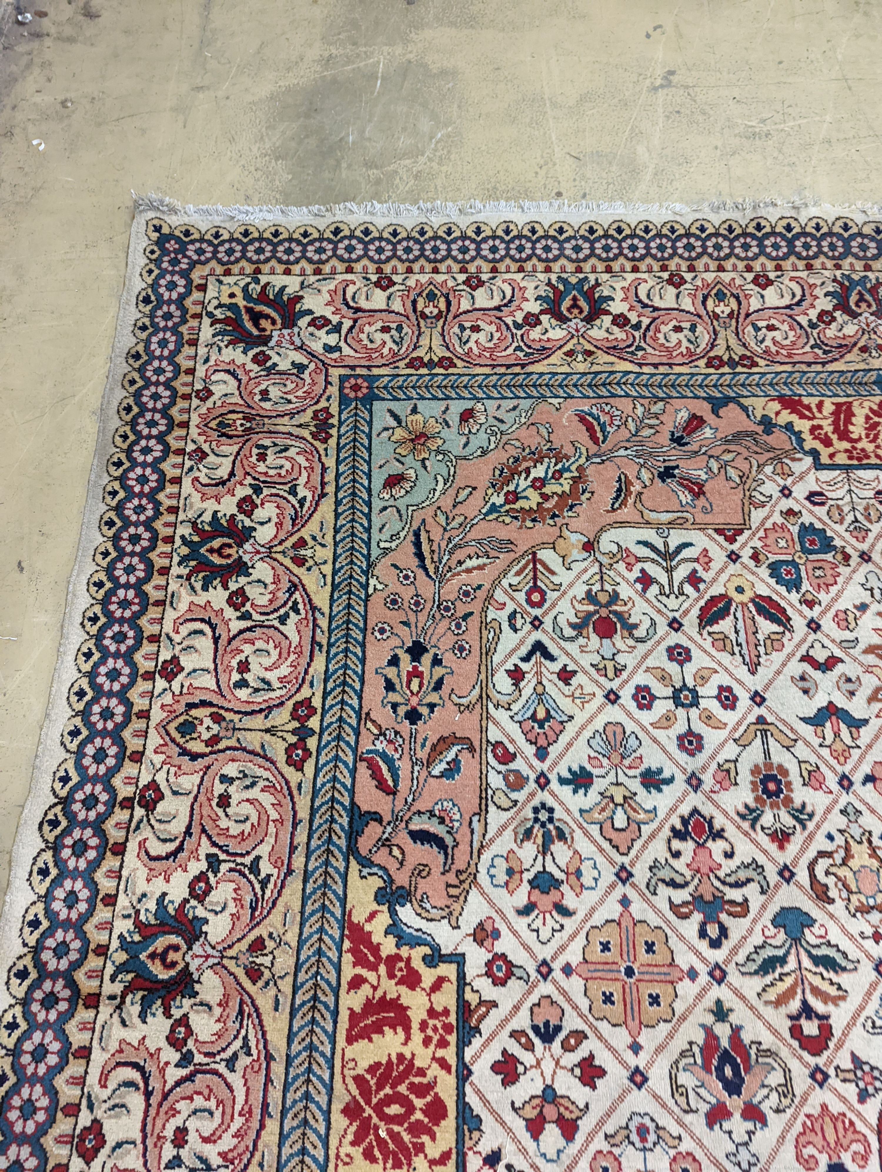 A Tabriz ivory ground carpet, 425 x 306cm